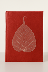 Handmade red Lokta notebook with real Bodhi leaf design, crafted from tree-free Nepali paper.