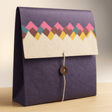 Side view showing the spacious interior of a purple Lokta paper seminar folder with secure flap closure