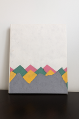 Handmade Lokta paper notebook with multicolor mountain-inspired design on natural white background